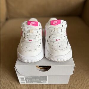 Nike Kids White Sneakers with Pink Accents